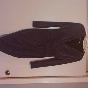 Purple sequin knee length dress with deep v knexk line a criss cross layover bof